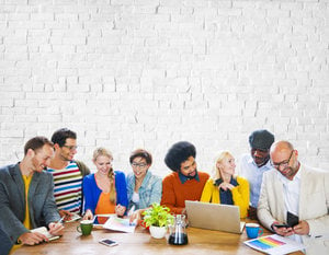 marketing team sitting at a table collaborating