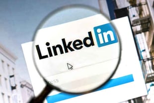magnifying glass over LinkedIn page